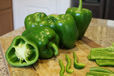 Green peppers on a cutting board