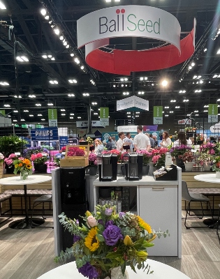 Coffee bar at a tradeshow with flower and plants