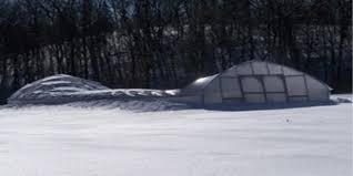 Collapsed roof of a greenhouse from heavy snow