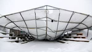 Greenhouse with a sunken roof from heavy snow